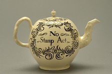 A creamware teapot made in England around 1766-1770, inscribed 'No Stamp Act', held at the Smithsonian's National Museum of American History.