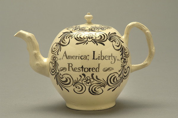 The reverse side of the creamware teapot, inscribed 'America, Liberty Restored'.